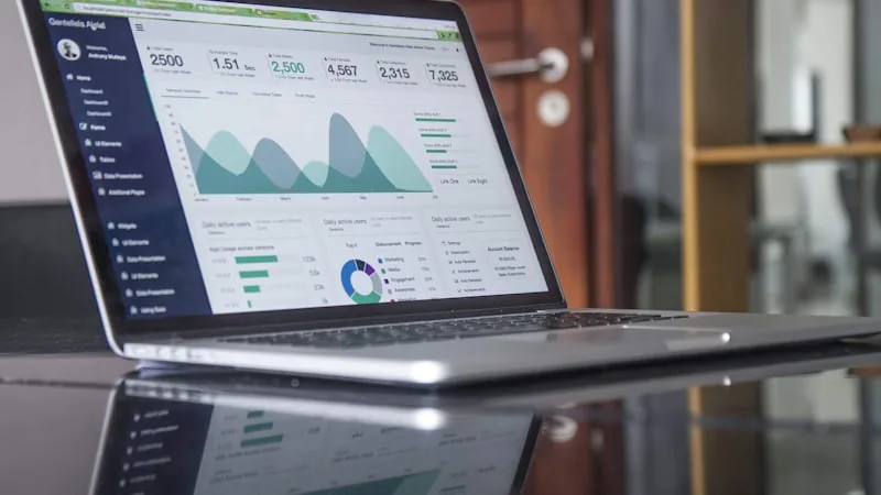 Sales team reviewing pricing plans on laptop